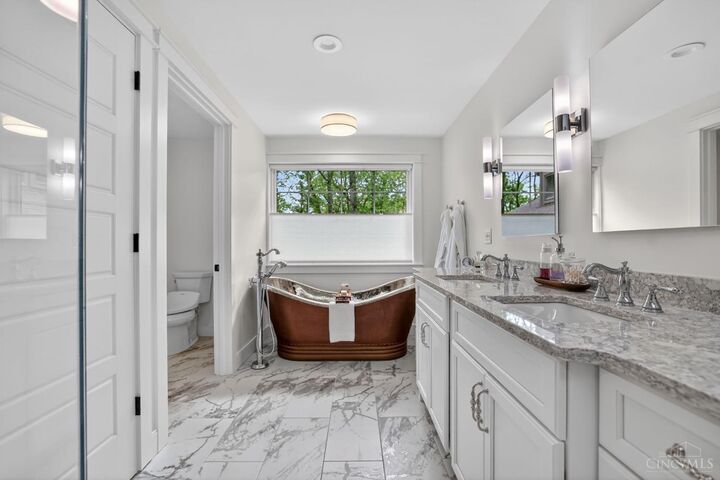 Spa bath with copper soaker tub and dual quartz vanity