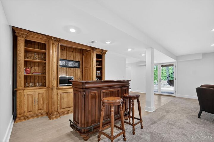 Lower-level built-in bar with seating