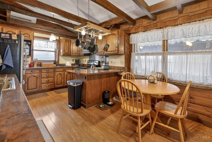 Eat-in kitchen with wood cabinetry