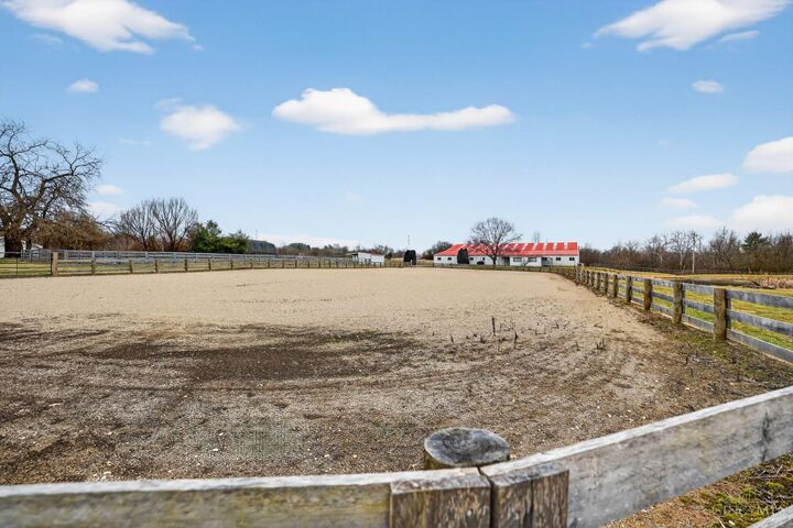 Fenced outdoor riding arena