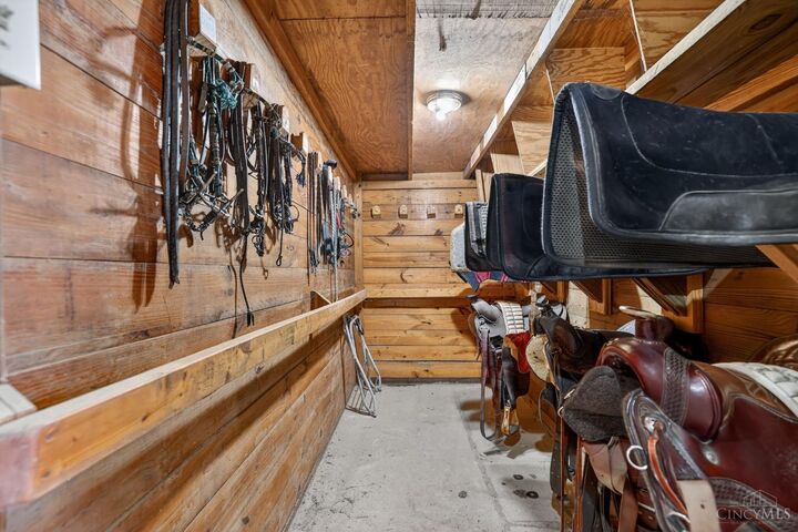 Tack room with saddle and bridle storage