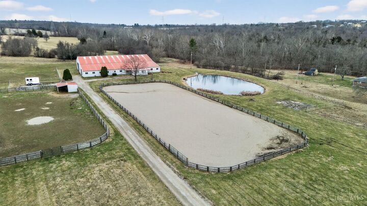 Aerial of the outdoor arena, barn, and pond on the estate