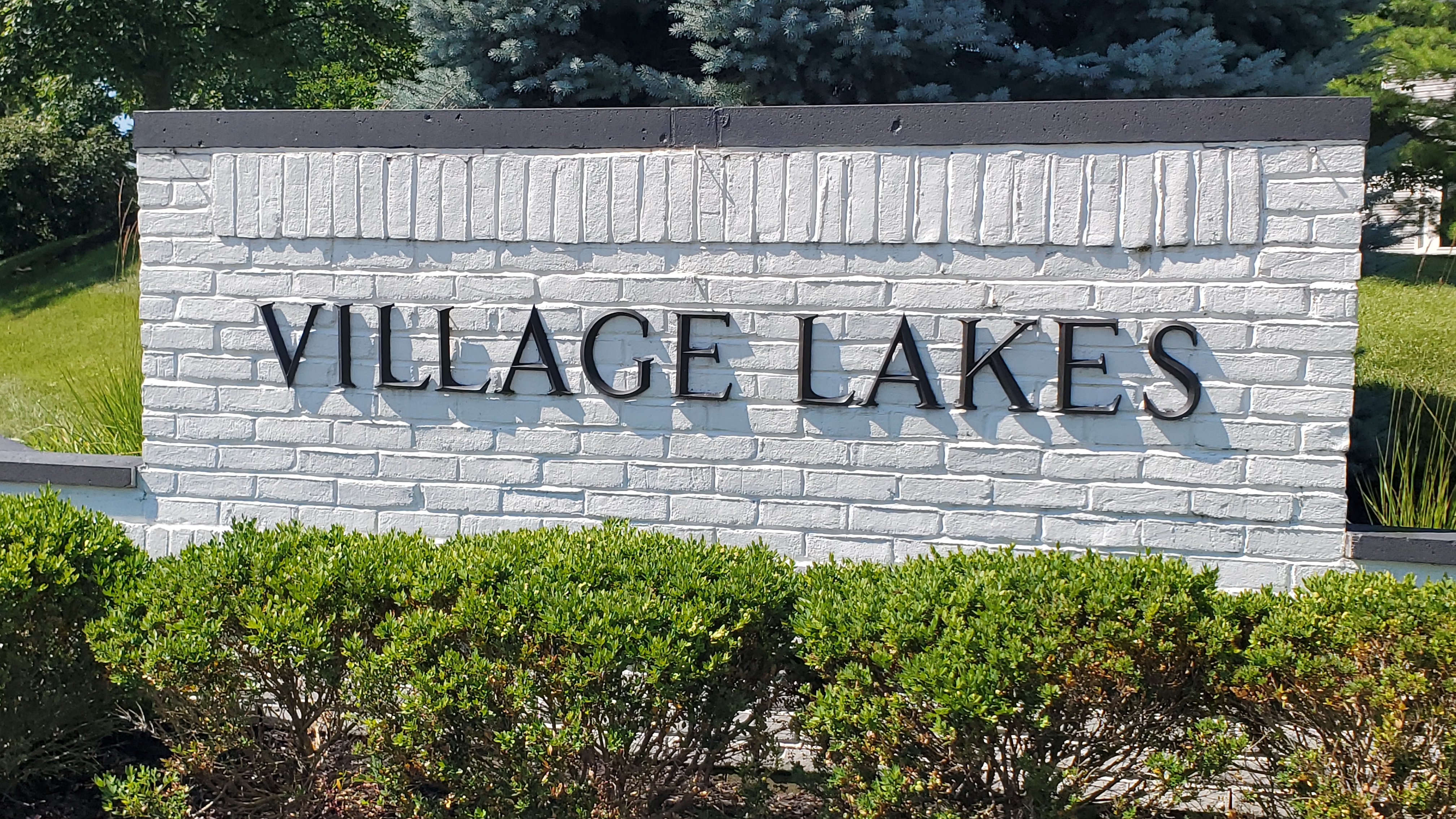 Village Lakes Condos neighborhood sign